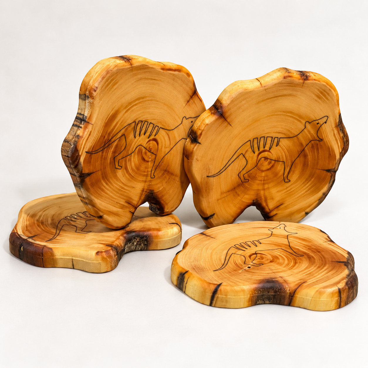 Live-edge Huon pine coasters engraved with thylacine motifs
